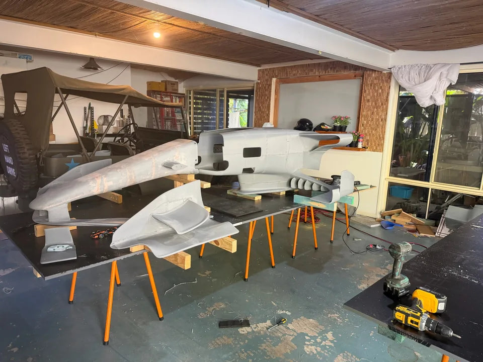 Printed body sections assembled on stands in the original workshop