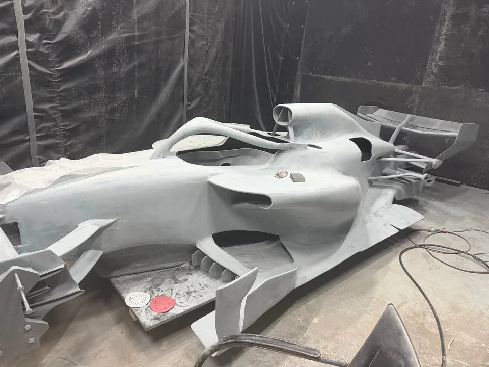 Workshop view of separated body sections during surface preparation