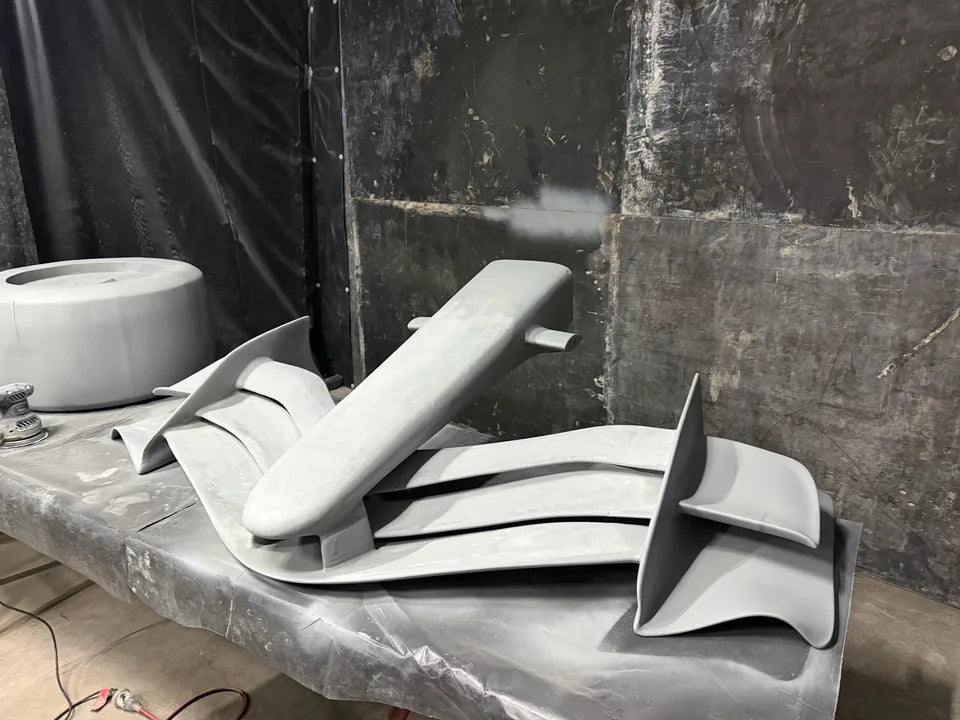 Shaped body and wing components laid out for preparation