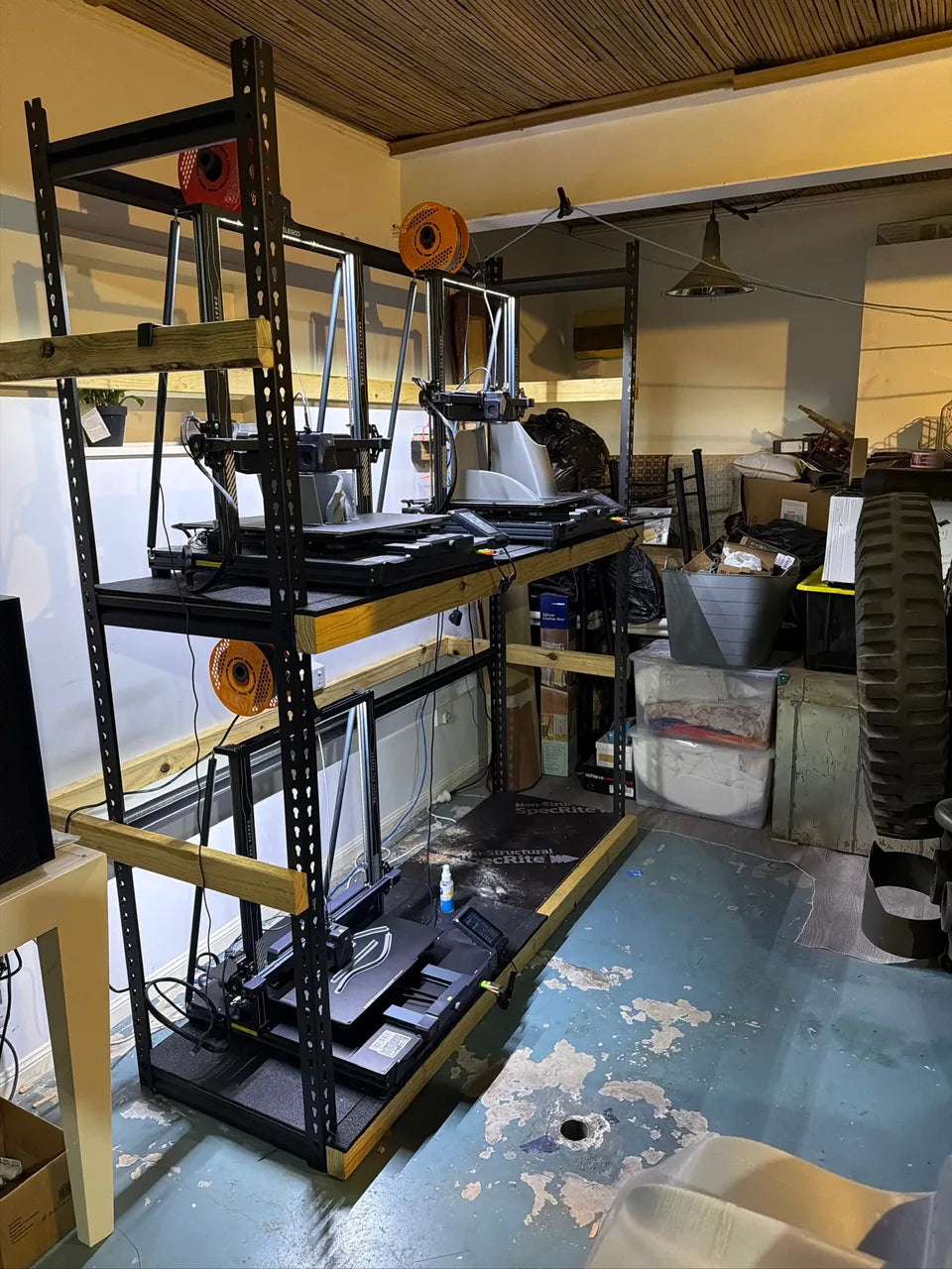 A rack of 3D printers used for the build components