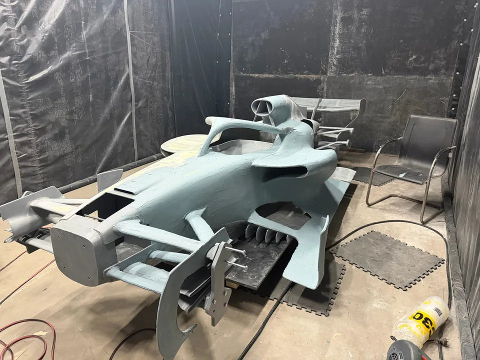 The unfinished Formula-inspired body during detailed surface preparation