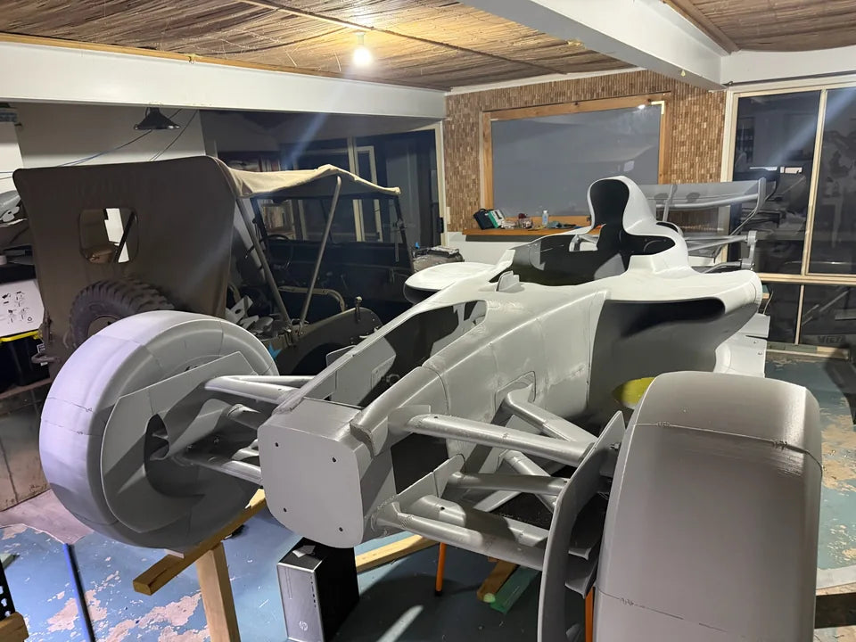 Rear wing and body sections during workshop assembly